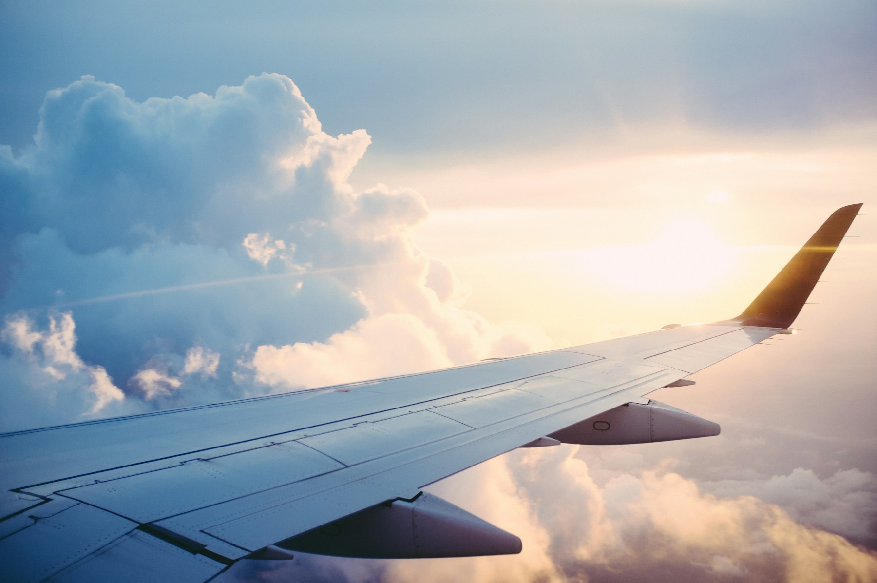 Boeing aircraft taking off at sunset